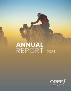 Cover of the 2024 OREF Annual Report Two climbers are at the crest of a rock. The one on top helps the other up.